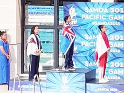 Tilali Scanlan on the pdoium after winning her silver medal with gold winner Moana Wind and bronze, Poerani Bertrand