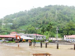Water standing amid pilings at new Fono building site