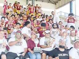 The Warriors football team and coaches