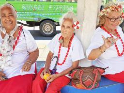 Three senior citizens at bus stop 