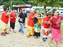 Senior citizens participating in a line dance at Su’igaula