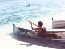 Ta'u kid with his va'a apa 