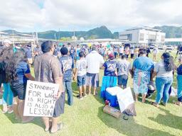 Striking SPA teachers with their supporters outside of the school.