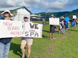SPA teachers on strike holding signs