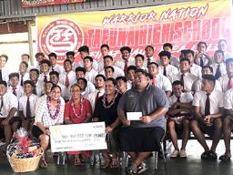  Pictured are the Warriors football players with school principal Tutuila Togilau, Head Coach  Kevin Magalei and McDonald’s reps Dolores Tautolo and Katie Leilua. 