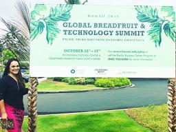 Tina Fonoimoana-Reid in front of Summit sign