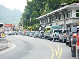 TRAFFIC BACK UP IN FROM OF POST OFFICE BUILDING