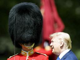 U.S. President Donald Trump inspects an honor guard 