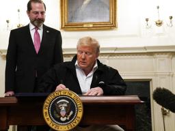 President Donald Trump signs an $8.3 billion bill to fight the coronavirus