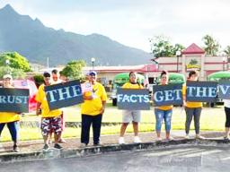 "Trust the Facts, Get the Vax" wave in Tafuna