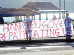 TTFAAS members with thank you banner waving to drivers passing by