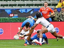 Tuna Tuitama goes over the top of Kevon Williams 