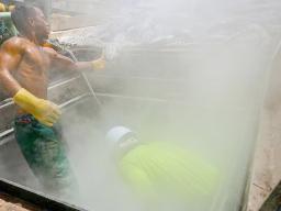 Two tuna fishermen working on deck