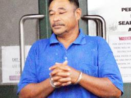 Tusi Fala in handcuffs after his initial appearance in court 