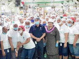 Amata with StarKist workers on the canning floor