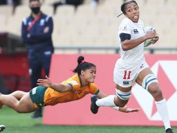 USA's Kris Thomas scores against Australia