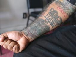 Julio Torre shows his USMC tattoo
