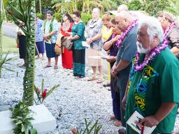 Utu Abe Malae's gravesite surrounded by people who attended his 1 year memorial service