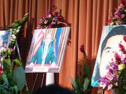  three enlarged photos of him, including one during his brief time as Saole senator.