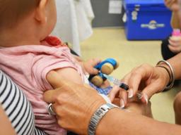 child receiving a vaccination