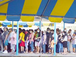 People crowding into vaccination site with no social distancing