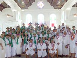 Vailoatai Choir, church and traditional leaders pose in the church