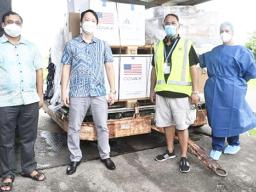 Sanoa govt officials accepting the U.S. vaccine donation