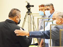 Vesi Talalelei Fautanu Jr (left) fist bumps with Manu’a #1 Faipule Alumamalu Filoiali’i Ale
