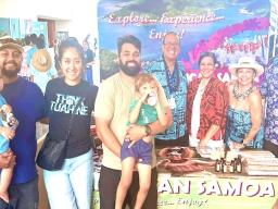 visitor's bureau staff greeting Samoans from around the world