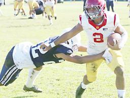  John Allen (2) of the Tafuna Warriors beating the last Samoana Sharks defender at the sidelines