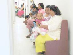 Mothers and babies wait at clinic