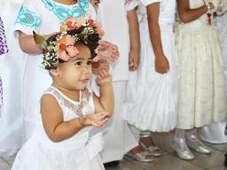 Little girl in her White Sunday best.
