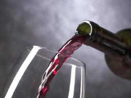 wine being poured into a glass