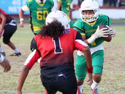 Misa Paiau of the JPS Lions is greeted by Vaouli of the JPS Vikings
