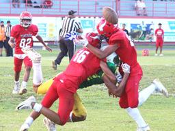 Two Faga’itua Viking defenders break up a pass