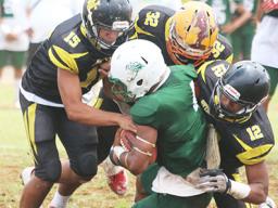 Leone Lions’ Joshua Taani being swallowed in the backfield by