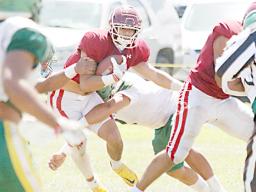 Chris Su’a (2) weaving his way through the heart of Leone’s defense