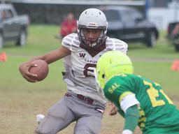 Francisco Mauigoa rolling out to the sidelines