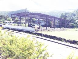 frame of new warehouse in a field