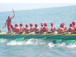 Zita Martel captaining her longboat inside the reef in Samoa.