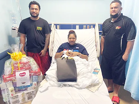 Faaleava Mack of Aasu receiving gifts