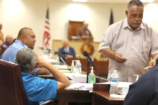 Faipule Suʻa Alex Jennings from the back being bypassed by house clerk