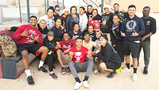 Amata is pictured with U.S. Army soldiers from the 962nd Quartermaster Company 