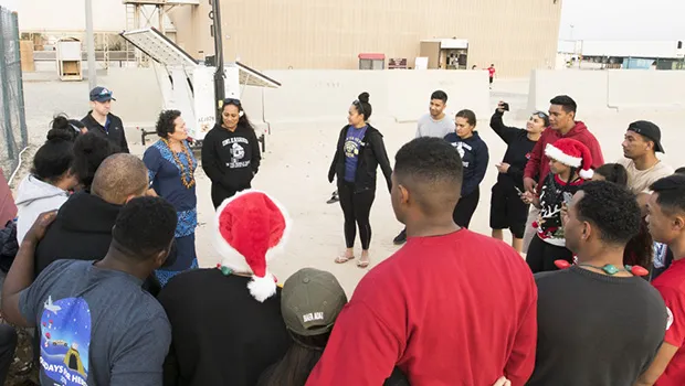 Amata pictured with some of the U.S. Army soldiers from the 962nd Quartermaster Company