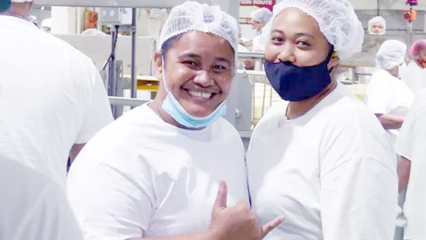 Two woman who work for StarKist Samoa
