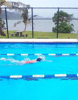PHS high school student works to perfect his freestyle stroke.