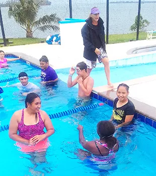 PHS's high school swimming class with instructor, Debbs Cox