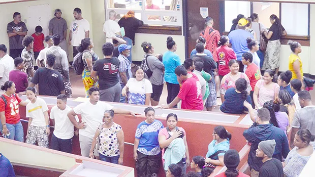 People lining up at Disbursement window to get $100