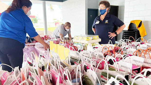 Lions Club members assemble gift packages 