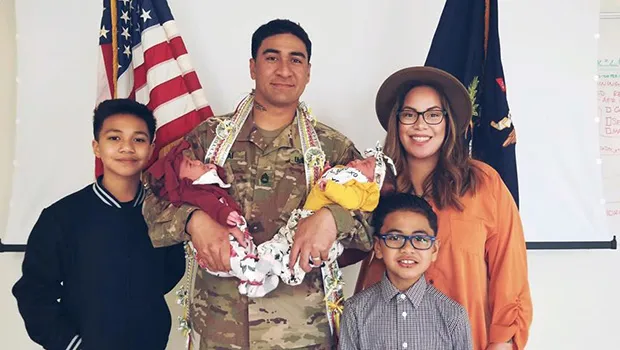 Infantry Drill Sergeant Mumaina Lagai with his wife and children